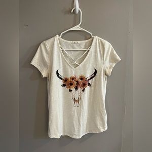 Size small Maurice’s tee with cow skull graphic and cross cross front